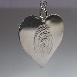 Custom engraved tungsten fingerprint pendant.